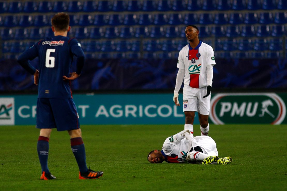 Neymar writhes in pain after suffering an injury during a French Cup match against Cean last week.