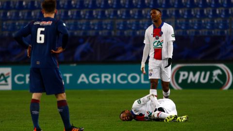 Neymar writhes in pain after suffering an injury during a French Cup match against Cean last week.