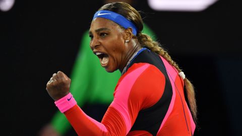 Williams celebrates after winning a point against Halep.