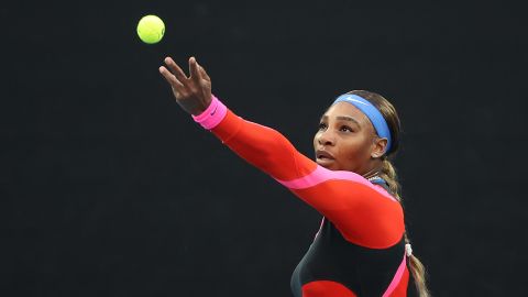 Williams serves against Halep during their women's singles match.