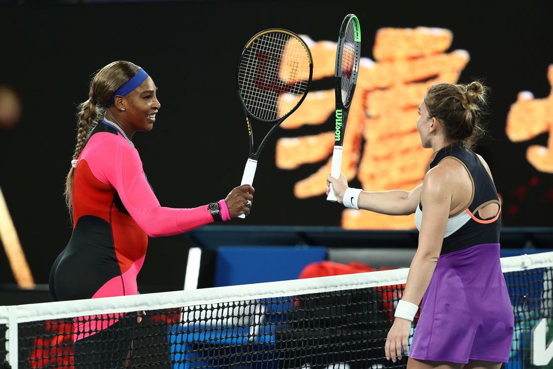 Williams and Halep touch racquets at the net following match. 