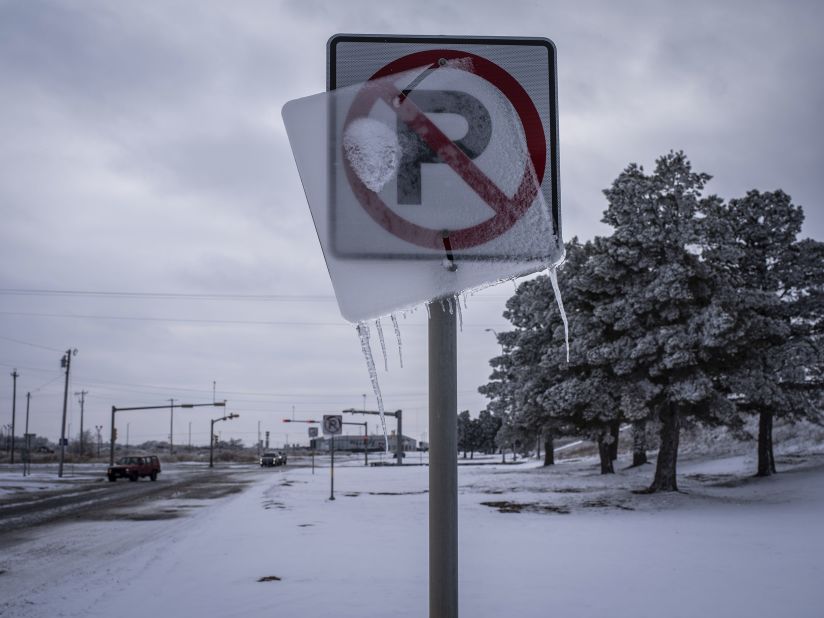 Ice coats a road sign in Midland, Texas, on Monday.