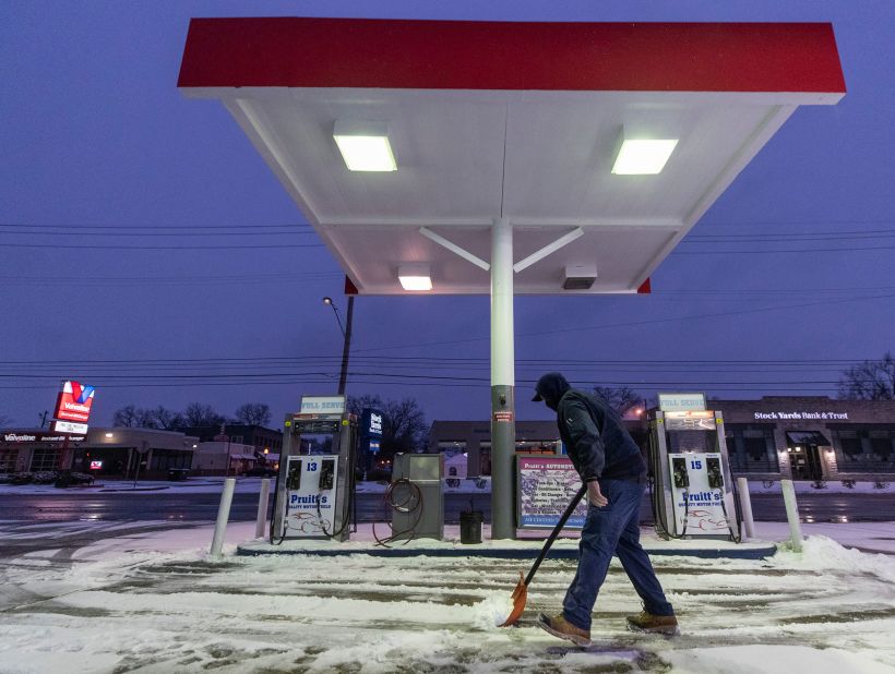 Kirk Caudill shovels snow in Louisville, Kentucky.