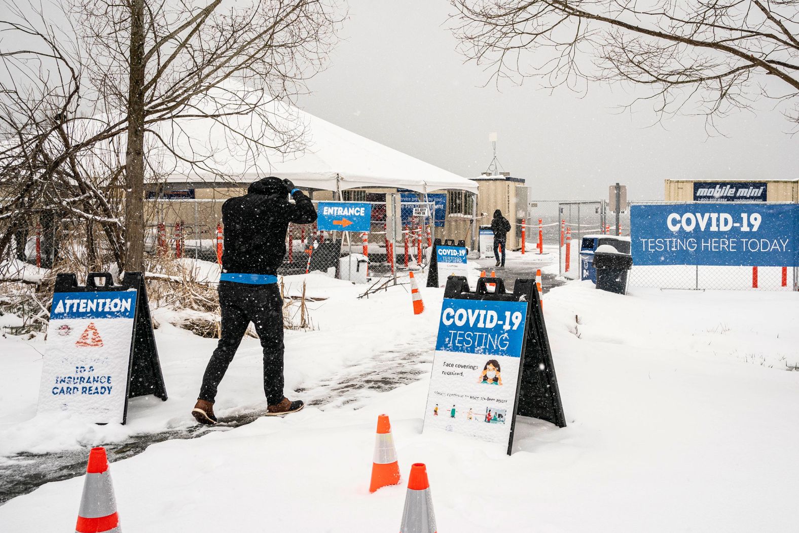 People enter a Covid-19 testing site in Seattle on Saturday, February 13. Seattle reported more than 11 inches of snow over the weekend, its most since January 1972.