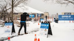 SEATTLE, WA - FEBRUARY 13: People enter a COVID-19 testing site on February 13, 2021 in Seattle, Washington. A large winter storm dropped heavy snow across the region. (Photo by David Ryder/Getty Images)