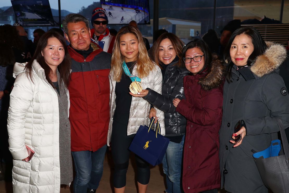 U.S. Olympian Chloe Kim poses for a photo with her family at the USA House in PyeongChang.