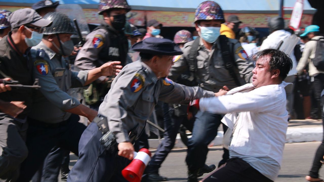 Police arrest a protester during a demonstration against the military coup in Mawlamyine, Mon State on February 12.