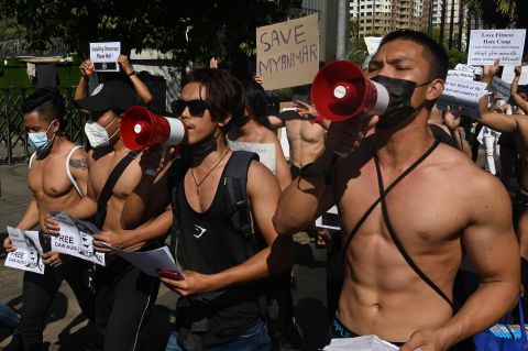 Bodybuilders take part in a protest in Yangon on February 11.