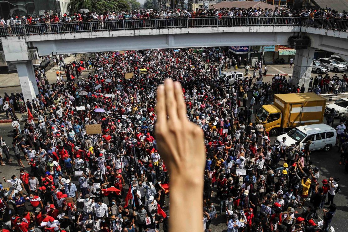 A demonstrator shows the three-finger salute as people rally in a protest against the military coup in Yangon, Myanmar, on February 7.