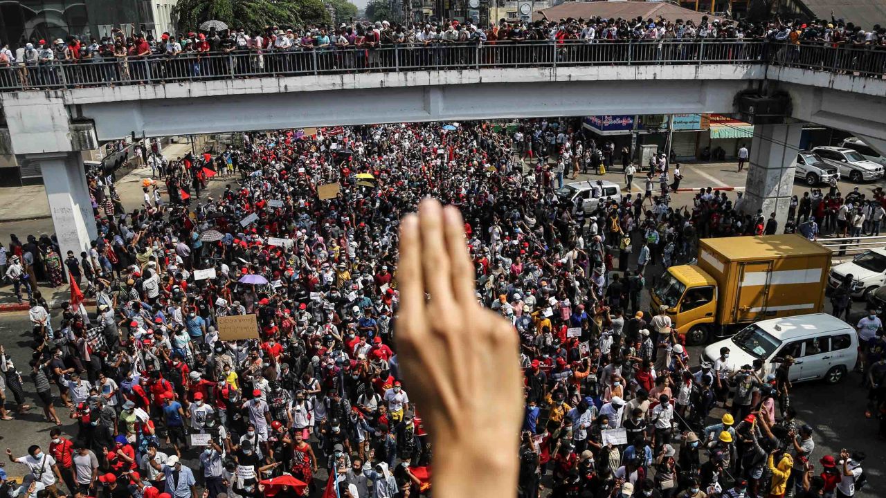 A demonstrator shows the three-finger salute as people rally in a protest against the military coup in Yangon, Myanmar, on February 7.