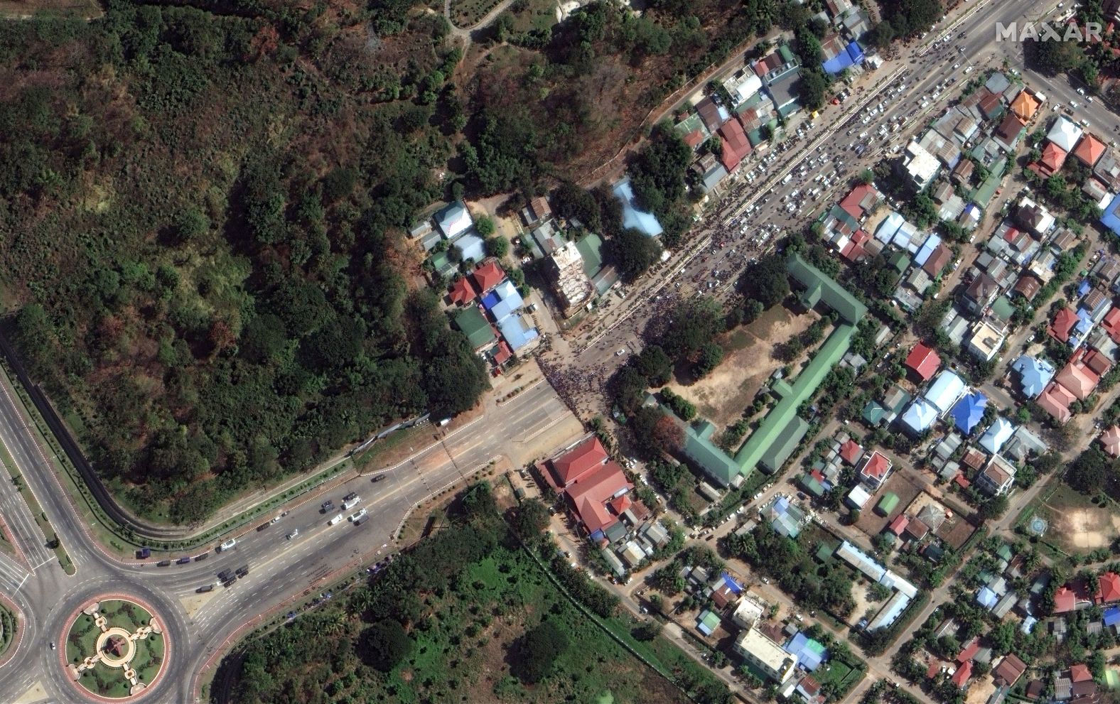 Another two images, dated February 13th, show protestors in Naypyitaw, face to face with what appears to be a line of police along the central Taungnyo Road, causing them to stop in the highway. 