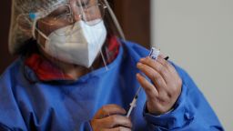 A health worker prepares to administer a dose of Russia's Sputnik V vaccine against the novel coronavirus disease, COVID-19, at the Cotahuma Hospital in La Paz, on February 3, 2021. (Photo by Jorge BERNAL / AFP) (Photo by JORGE BERNAL/AFP via Getty Images)