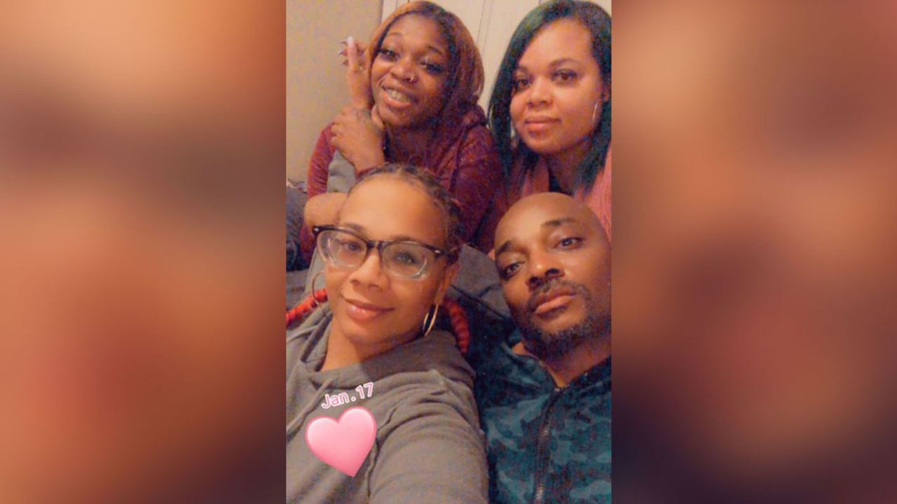 Bernard Howard, with his daughters after exoneration.