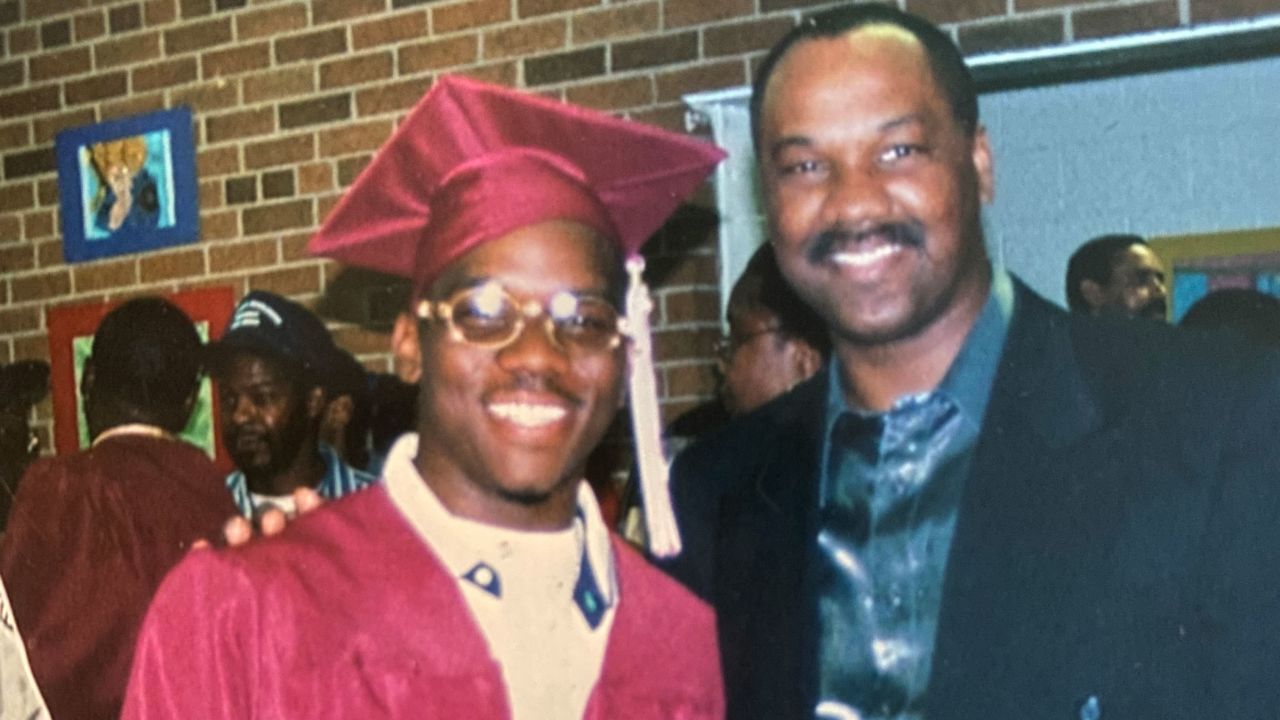Kevin Harrington in 2001, at his high school graduation with his father, Michael Harrington Sr.