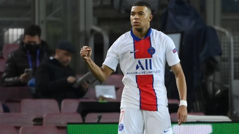 Kylian Mbappe celebrates after scoring his first goal against Barcelona.