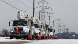 \Electric Utility trucks are parked in the snow along the street in front of the Oncor facility on the southwest side of town in preparation of power outages due to weather, in Fort Worth, Texas, USA, 16 February 2021. Snow and cold weather blanket North Texas after a record breaking cold. Overnight temperatures dropped to -18 degrees celsius. A winter storm has brought historic cold weather across the United States. In Texas the unprecedented temperatures have knocked out power to over a million people.