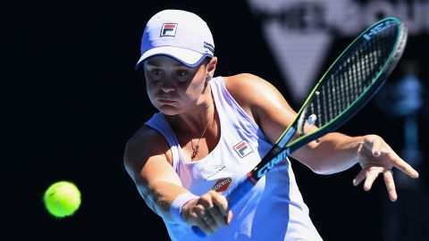 Barty hits a return against Muchova.