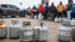 People line up to fill their empty propane tanks Tuesday, Feb. 16, 2021, in Houston. Temperatures stayed below freezing Tuesday, and many residents were without electricity.