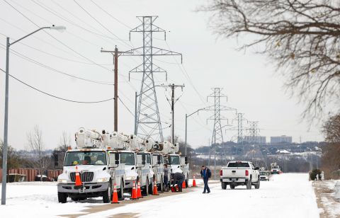 Electric service trucks line up in Fort Worth, Texas, on Tuesday.