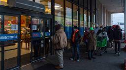 HOUSTON, TX - FEBRUARY 16: People wait in line to enter Fiesta supermarket on February 16, 2021 in Houston, Texas. Winter storm Uri has brought historic cold weather, power outages and traffic accidents to Texas as storms have swept across 26 states with a mix of freezing temperatures and precipitation. (Photo by Go Nakamura/Getty Images)