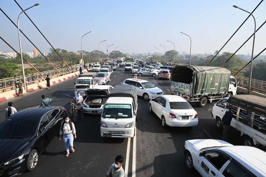 Demonstrators block a Yangon bridge with their cars on February 17.