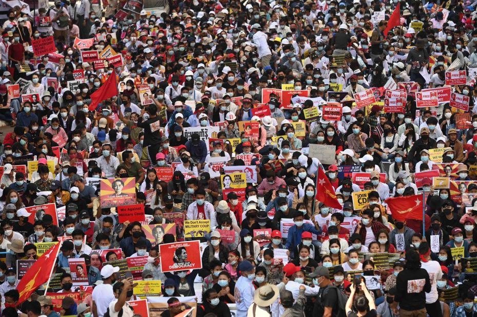 Protesters block a major road during a demonstration in Yangon on February 17.