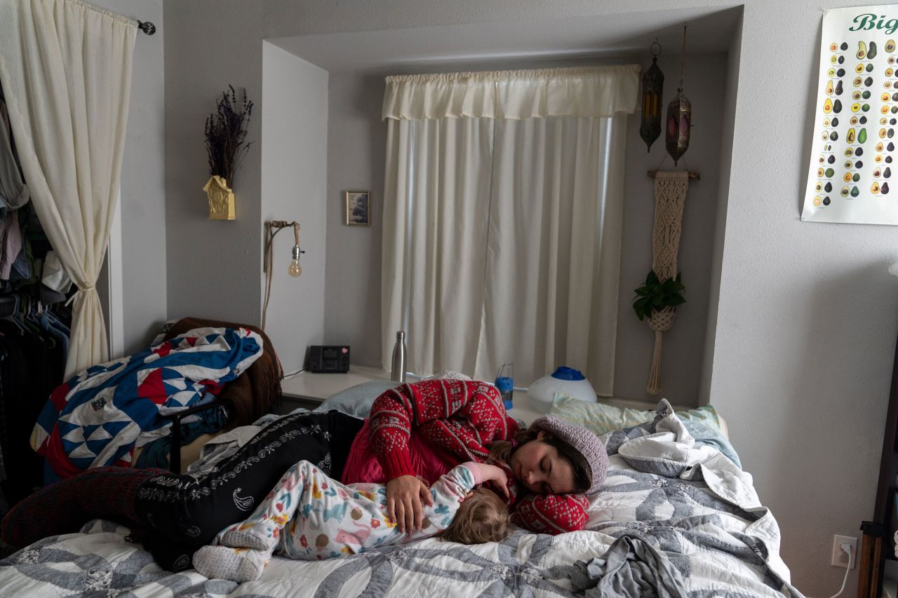 Maria Patterson breastfeeds her infant daughter Tuesday at their home in Austin, which hadn't had power since Sunday night.