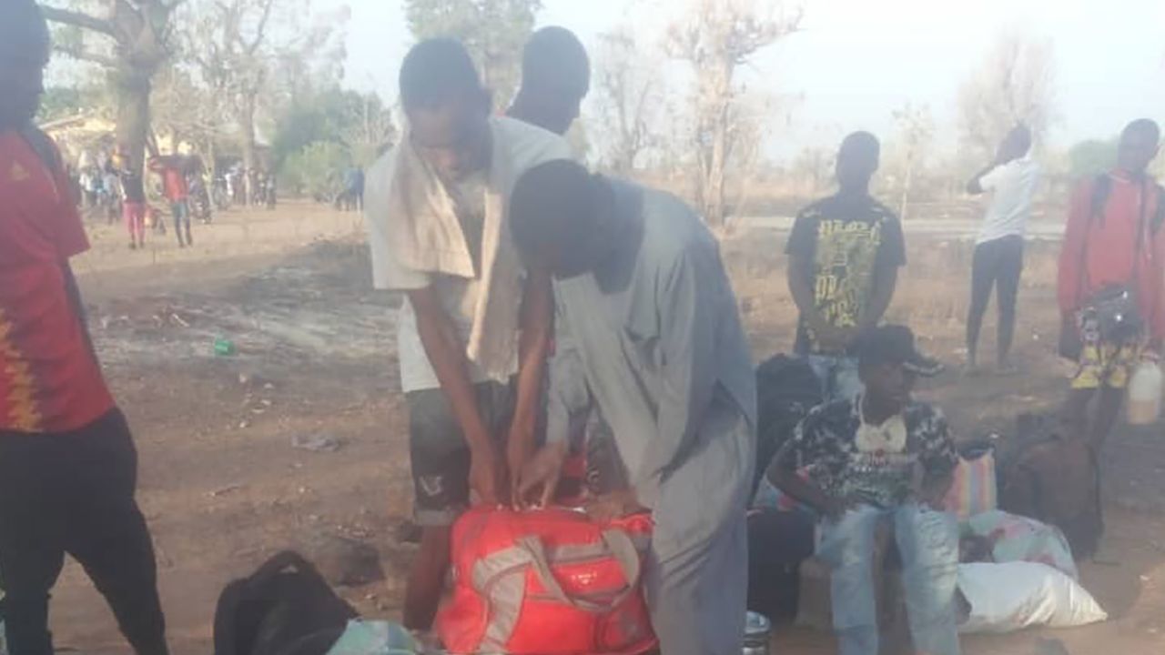 Students pack their bags to leave the school after the abduction.