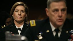 US Army Gen. Laura Richardson (L) sits behind US Army Chief of Staff, Mark Milley while testifies about women in the military during a Senate Armed Services Committee hearing on Capitol Hill, February 2, 2016 in Washington, DC. The committee heard testimony on a recent decision to open combat units to women. 