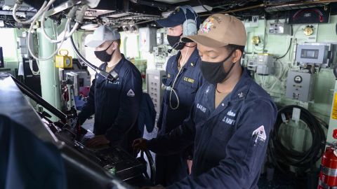 US sailors stand watch at the helm on the bridge as the guided-missile destroyer USS Russell. The warship is deployed to the US 7th Fleet area of operations in support of a free and open Indo-Pacific.