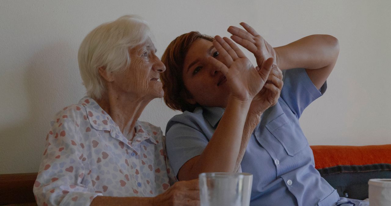 Chutimon (Pomm) Sonsirichai -- seen here taking care of Elisabeth Röhner -- is profiled in Kristof Bilsen's documentary "Mother."