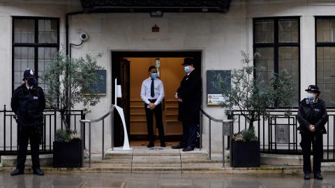 Police stand guard outside London's King Edward VII hospital where Prince Philip was admitted on Tuesday evening.