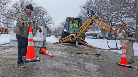 City of Richardson workers prepare to work on a water main pipe that burst due to extreme cold.