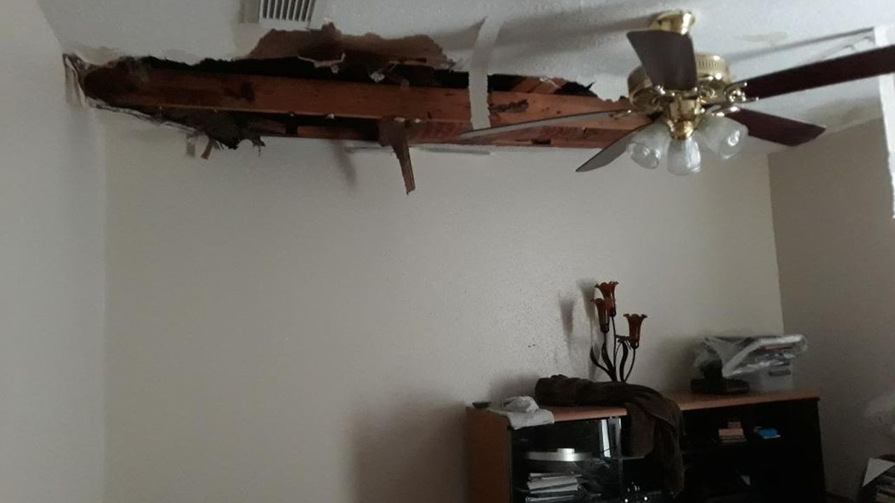 Sandra Erickson's ceiling in her rented home collapsed due to pipes bursting.