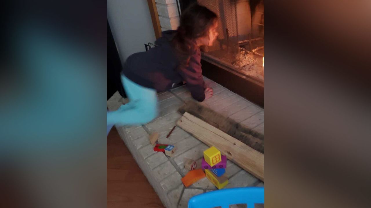 Angel Garcia shared a photo of her daughter, Jordan, watching the fire as her toys burned.