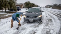 Jose' Nives tries to shovel his way out after getting stuck in the middle of the street. A winter storm that brought snow, ice, and plunging temperatures across Central Texas shut down roads and caused the electrical grid to shut down, leaving thousands of people without power.