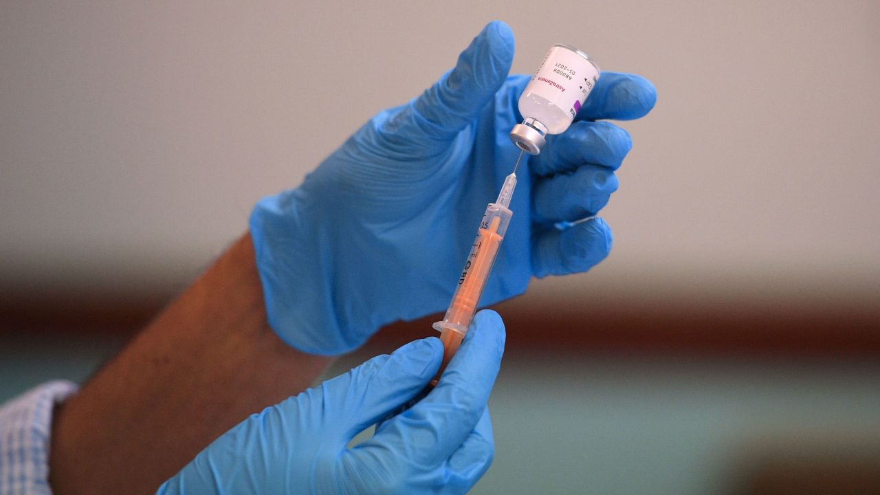 Pharmacist, Minhal Master prepares a dose of the AstraZeneca/Oxford Covid-19 vaccine at a temporary vaccination centre, staffed by pharmacists and pharmacist assistants, at the Al-Abbas Islamic Centre in Birmingham, West Midlands on February 4, 2021. - Oxford University announced on Thursday it will launch a medical trial alternating doses of Covid-19 vaccines created by different manufacturers, the first study of its kind. (Photo by Oli SCARFF / AFP) (Photo by OLI SCARFF/AFP via Getty Images)