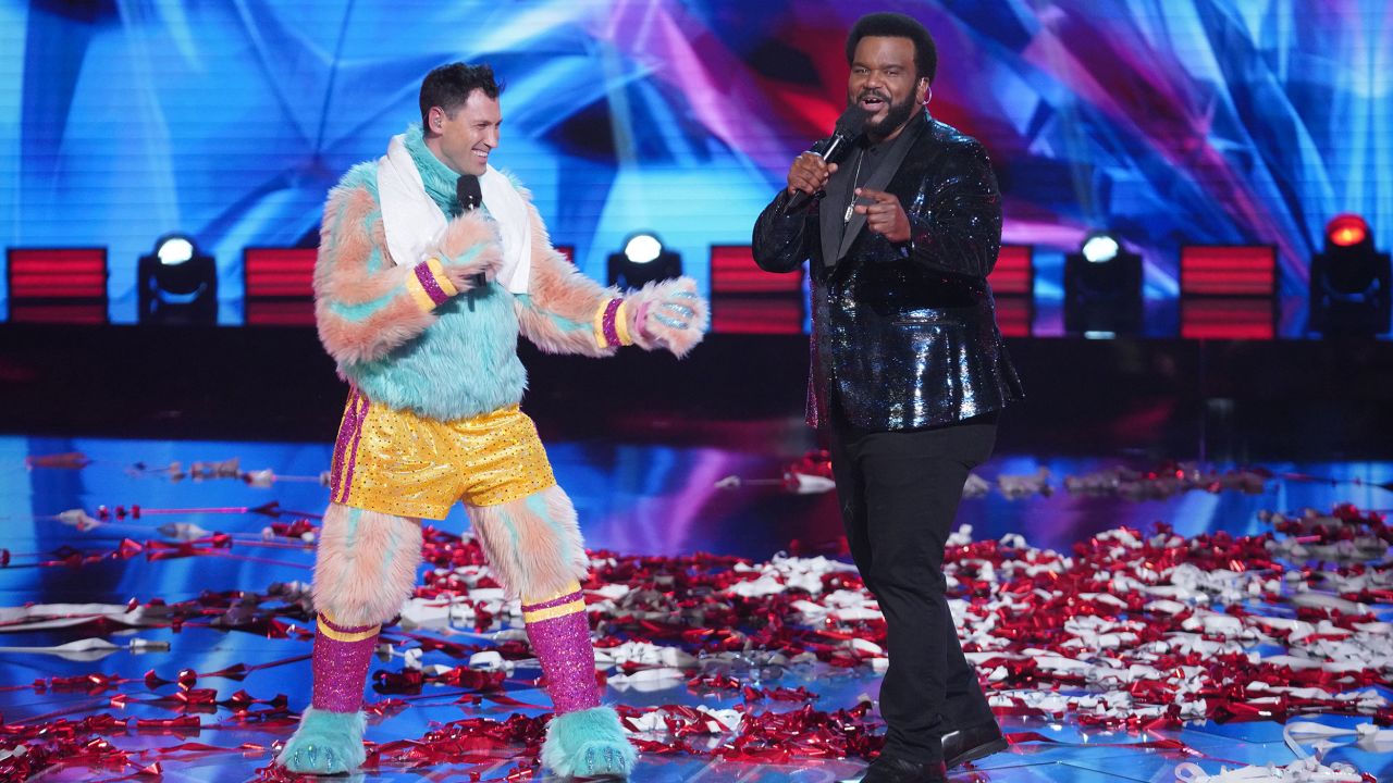 THE MASKED SINGER: L-R: Maksim Chmerkovskiy and host Craig Robinson in the "Road to the Finals -- Final Clues to the Mask!/ The Finale -- One Last Mask!" special two-hour season finale of THE MASKED DANCER airing Wednesday, Feb. 17 (8:00-10:00 PM ET/PT) on FOX.  © 2021 FOX Media LLC.
