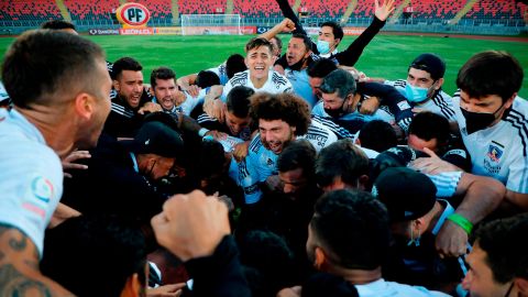 Colo-Colo players and staff celebrate the win over Universidad de Concepcion.