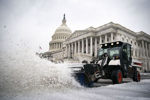 Snow is plowed outside the US Capitol on Thursday.