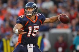 Quarterback Tim Tebow #15 of the Denver Broncos delivers a pass against the New England Patriots at Sports Authority Field at Mile High on December 18, 2011 in Denver, Colorado. 