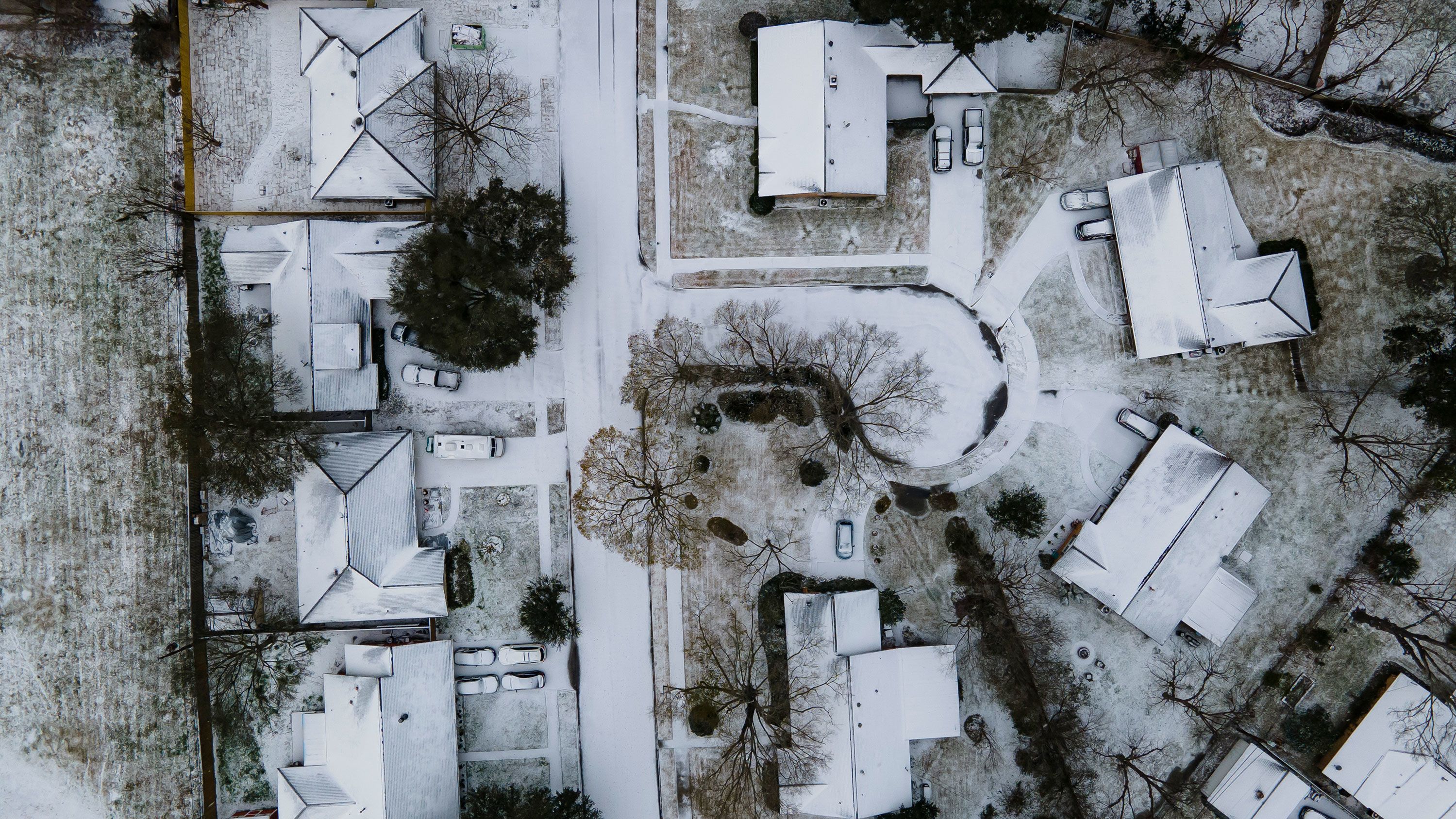 Homes in Houston are covered in snow on Monday, Feb. 15, 2021.