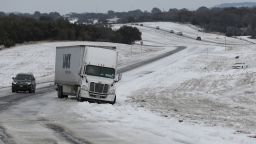 KILLEEN, TEXAS - FEBRUARY 18: A tractor trailer is stuck in the slick ice and snow on State Highway 195 on February 18, 2021 in Killeen, Texas. Winter storm Uri has brought historic cold weather and power outages to Texas as storms have swept across 26 states with a mix of freezing temperatures and precipitation. (Photo by Joe Raedle/Getty Images)