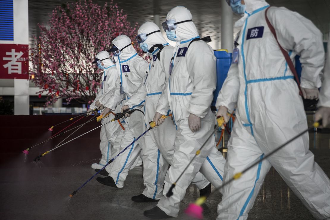 Firefighters disinfect Wuhan's international airport on April 3, 2020.