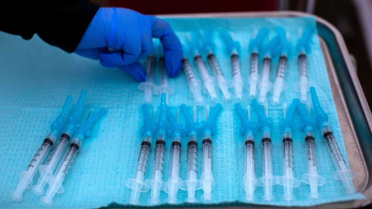 A nurse takes a Moderna Covid-19 vaccines ready to be administered at a vaccination site at Kedren Community Health Center, in South Central Los Angeles, California on February 16, 2021. 