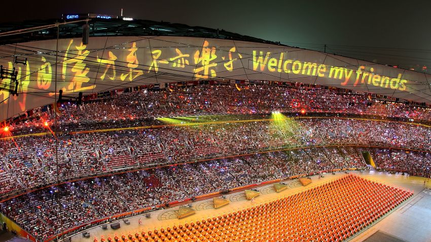 BEIJING - AUGUST 08:  A welcome message is displayed on the stadium roof as drummers perform during the Opening Ceremony for the 2008 Beijing Summer Olympics at the National Stadium on August 8, 2008 in Beijing, China.  (Photo by Ezra Shaw/Getty Images)