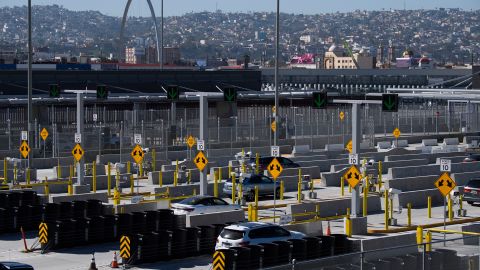 Vehicles enter a checkpoint as they approach the Mexico border at the US Customs and Border Protection San Ysidro Port of Entry at the US- Mexico border on February 19, 2021, in San Diego.