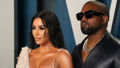 Kim Kardashian and the musician formerly known as Kanye West, seen here attending the 2020 Vanity Fair Oscar Party on February 9, 2020, have reached a divorce settlement, a source with knowledge of the negotiations tells CNN.