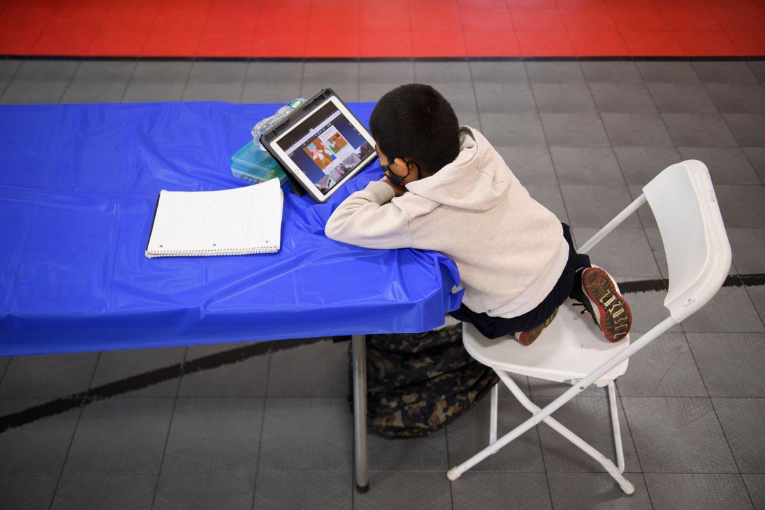 A child attends an online class at the Crenshaw Family YMCA on February 17, 2021, in Los Angeles.