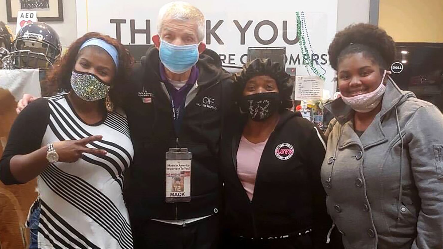 Furniture owner Jim "Mattress Mack" McIngvale with (from left) Felicia Maten, her mother Dora Maten Bell and her daughter Ebony Augustine.